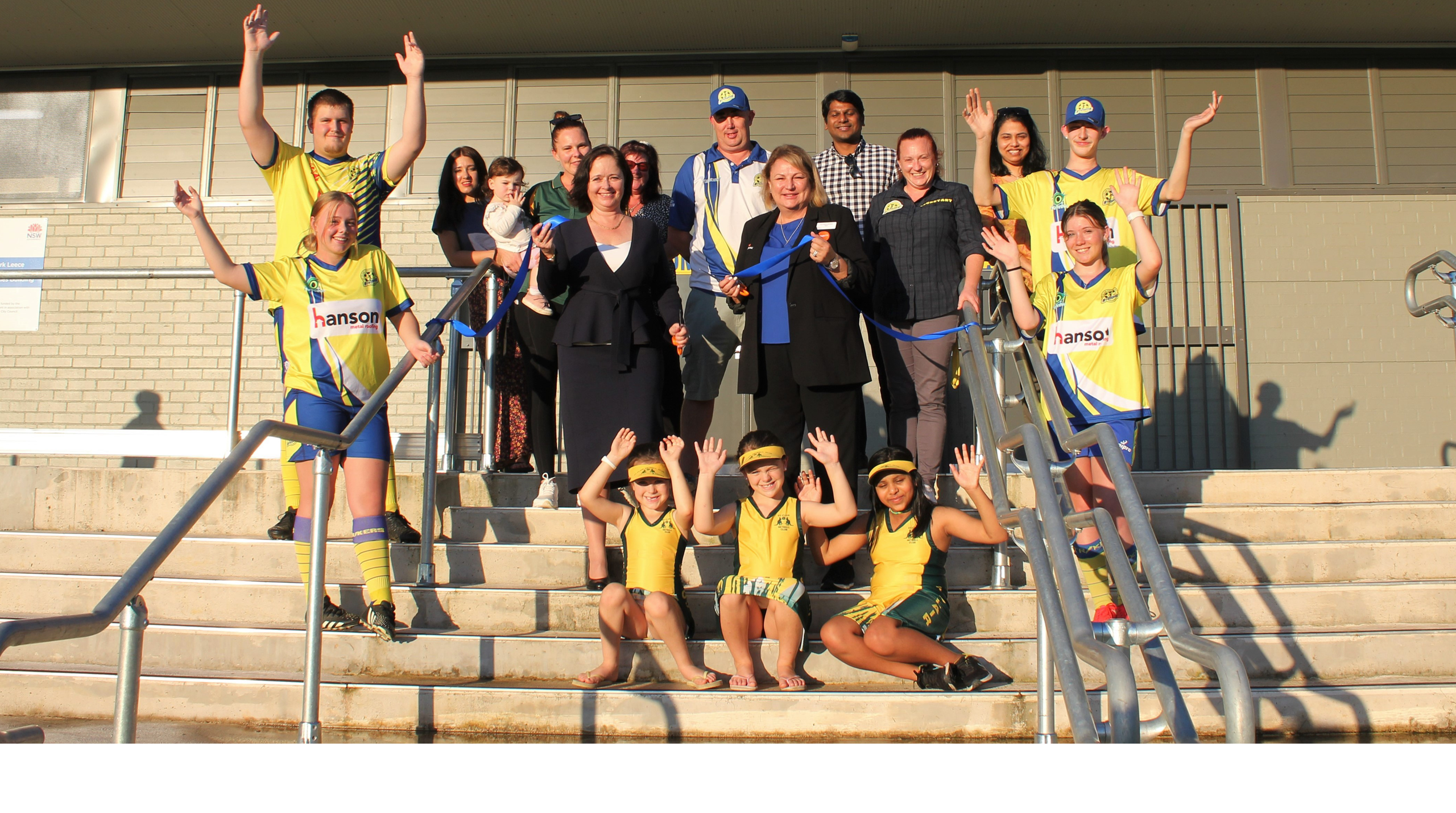 Penrith Mayor Tricia Hitchen and Tanya Davies MP celebrate the opening of the new amenities building at Mark Leece Oval in St Clair with representatives and players from St Clair United Soccer Club and St Clair Netball Club.