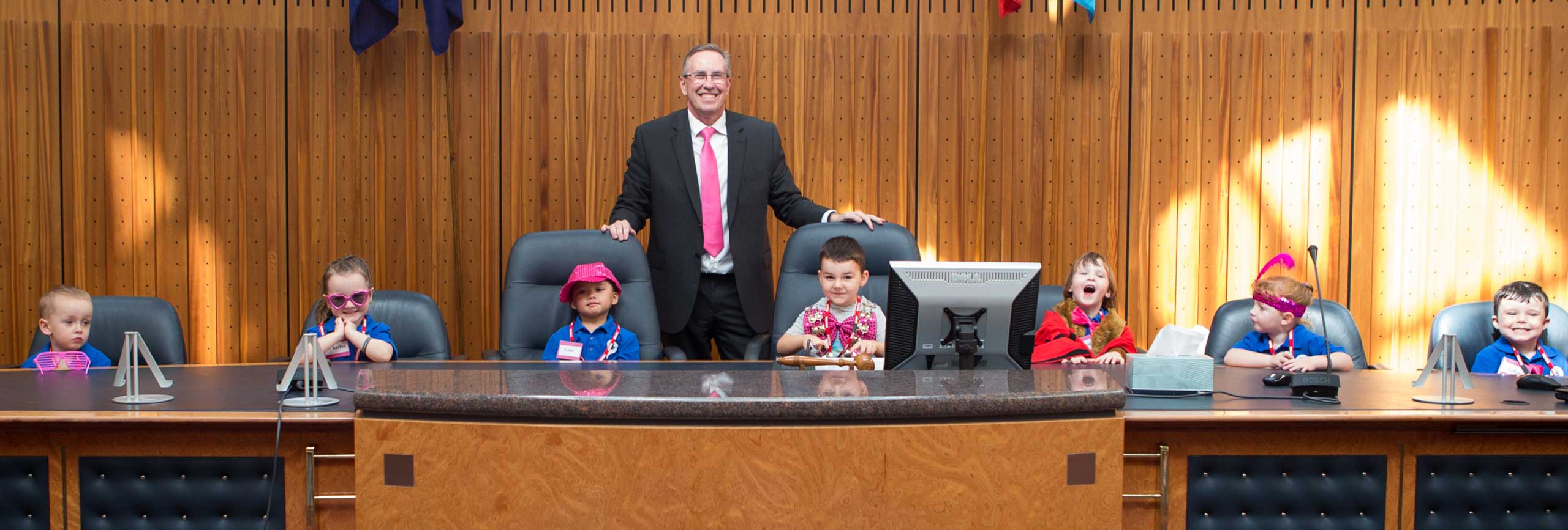 General Manager Warwick Winn (centre) in the Council Chambers with the children from Cook Parade Children’s Centre, St Clair