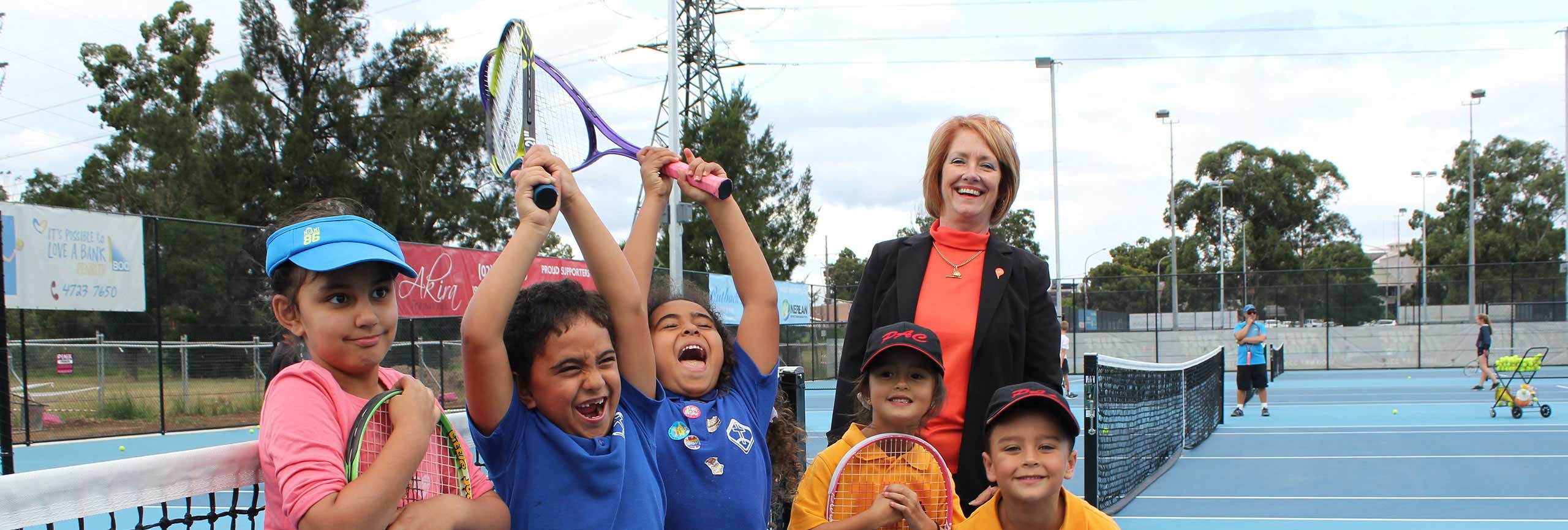 Penrith Mayor Cr Karen McKeown with children on Woodriff Gardens Tennis courts.