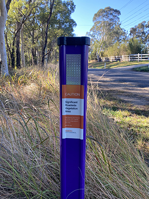 purple roadside markers where High Conservation Value vegetation