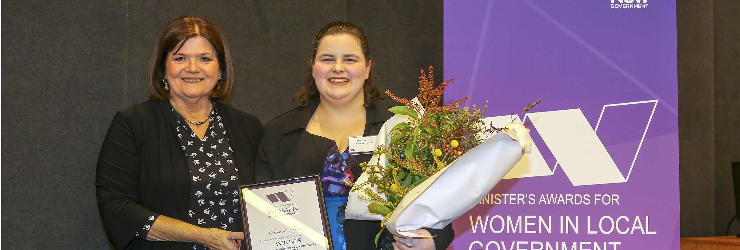 Sarah Tracy accepts her award from the Hon. Shelley Hancock MP