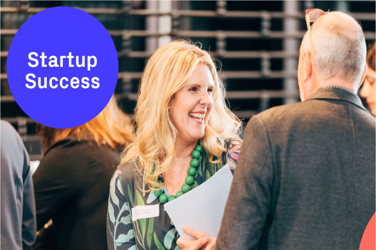 Startup Success Program image with photo of woman at networking event