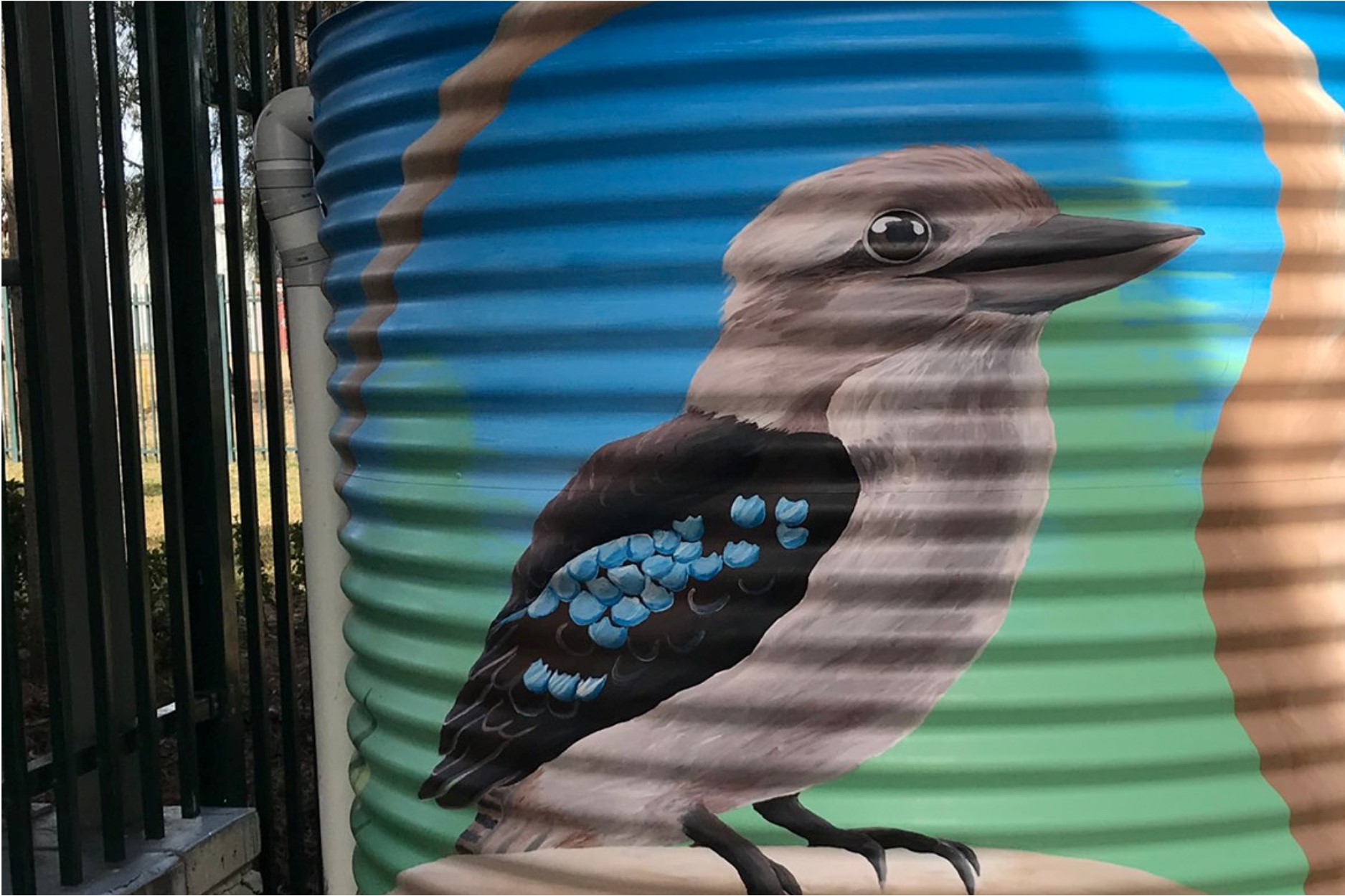 water tank covered in kookaburra painting