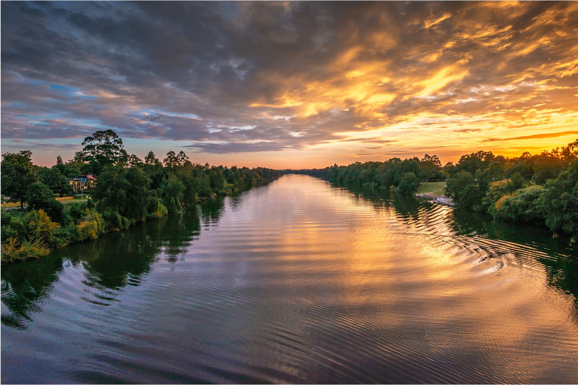 the sun setting over the nepean river