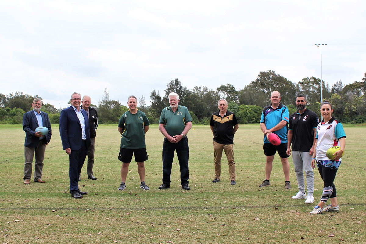 group of peoples standing on grass field