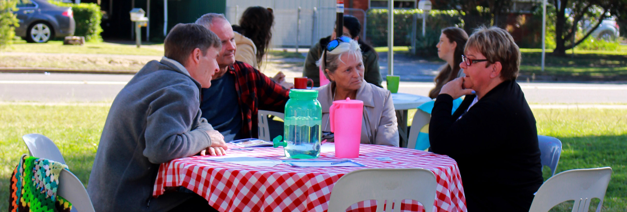 Group of people at outdoor cafe in park