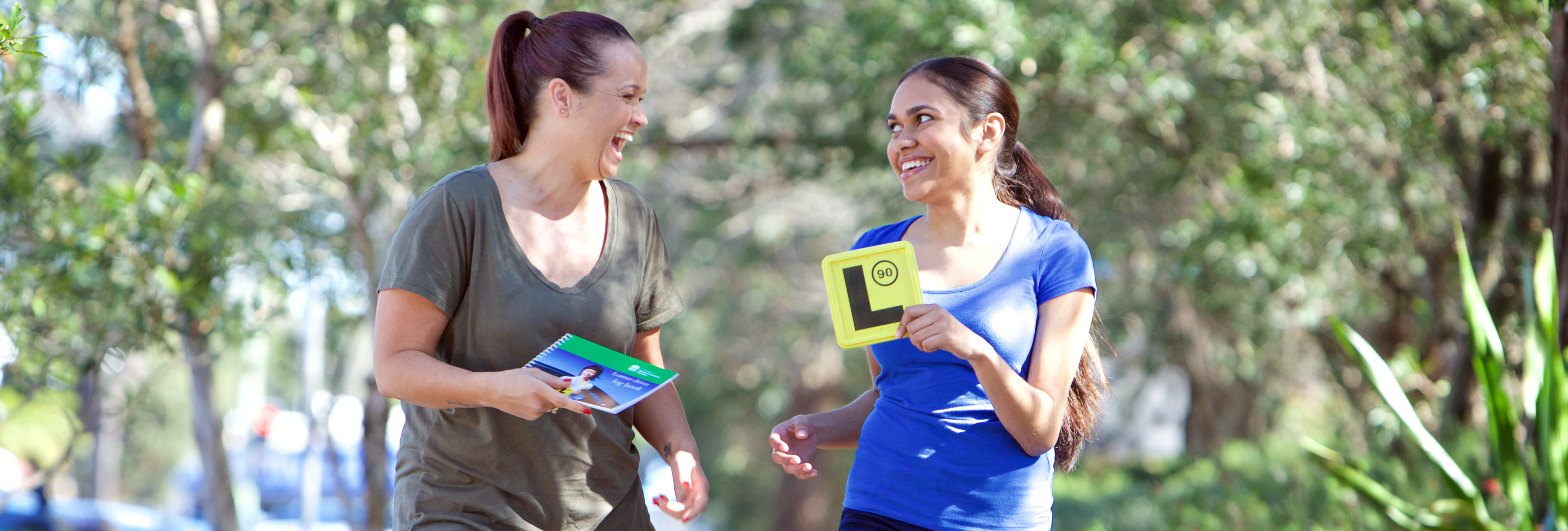 Two girls excited to be taking the Provisional Driver test after completing their Learner requirements.