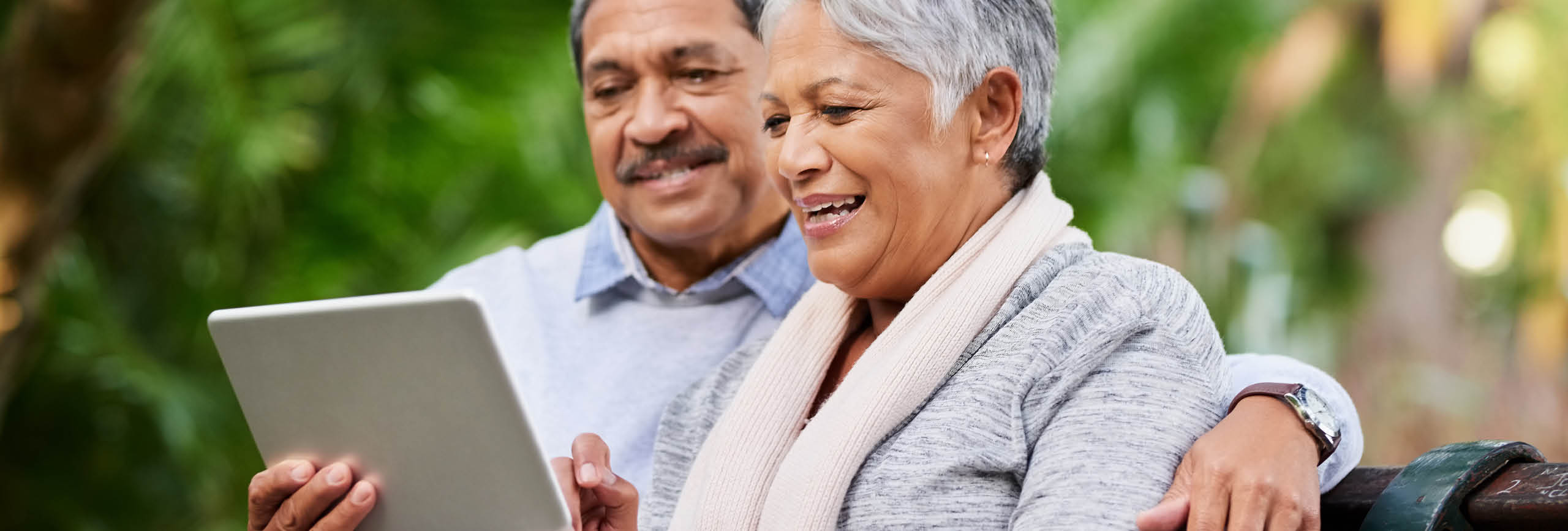 A man and woman on a device.