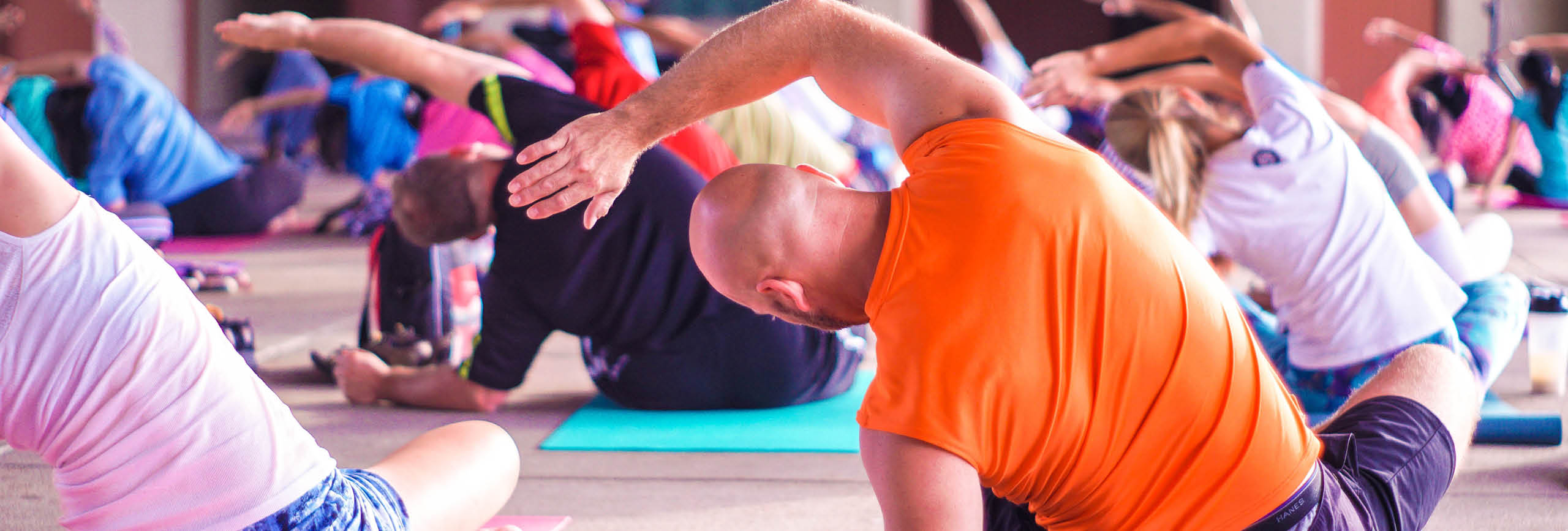 Woman stretching on yoga mat.