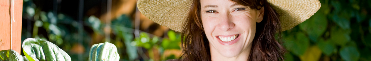 Lady in the garden wearing a large hat